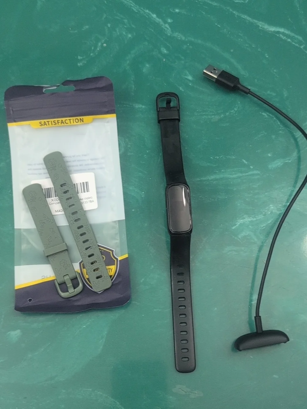 Black FitBit Inspire 3 with USB Charger And Extra Green Band